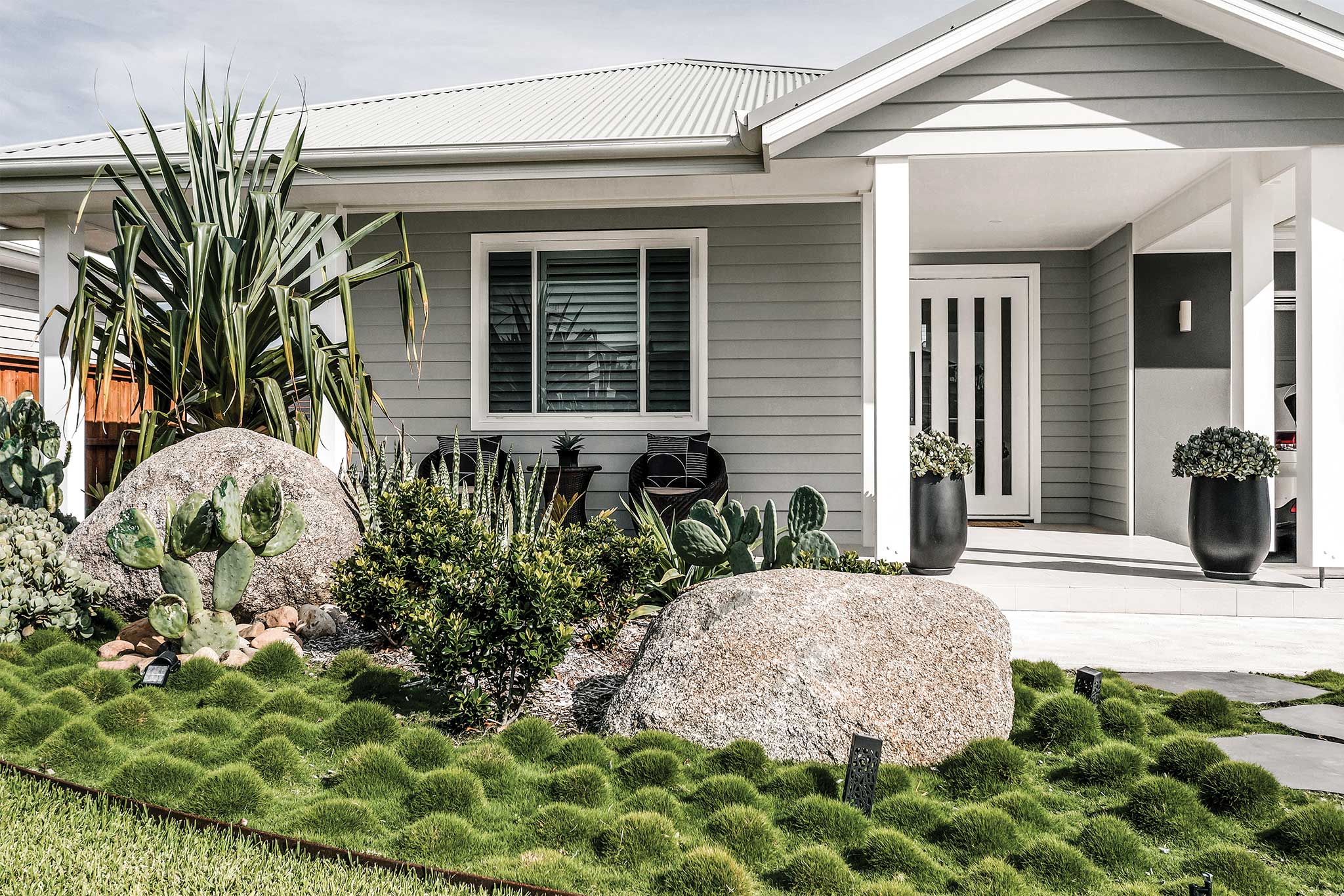 Landscape Design Construction Central Coast - Striking Oasis - Frontyard zoysia grass, boulder